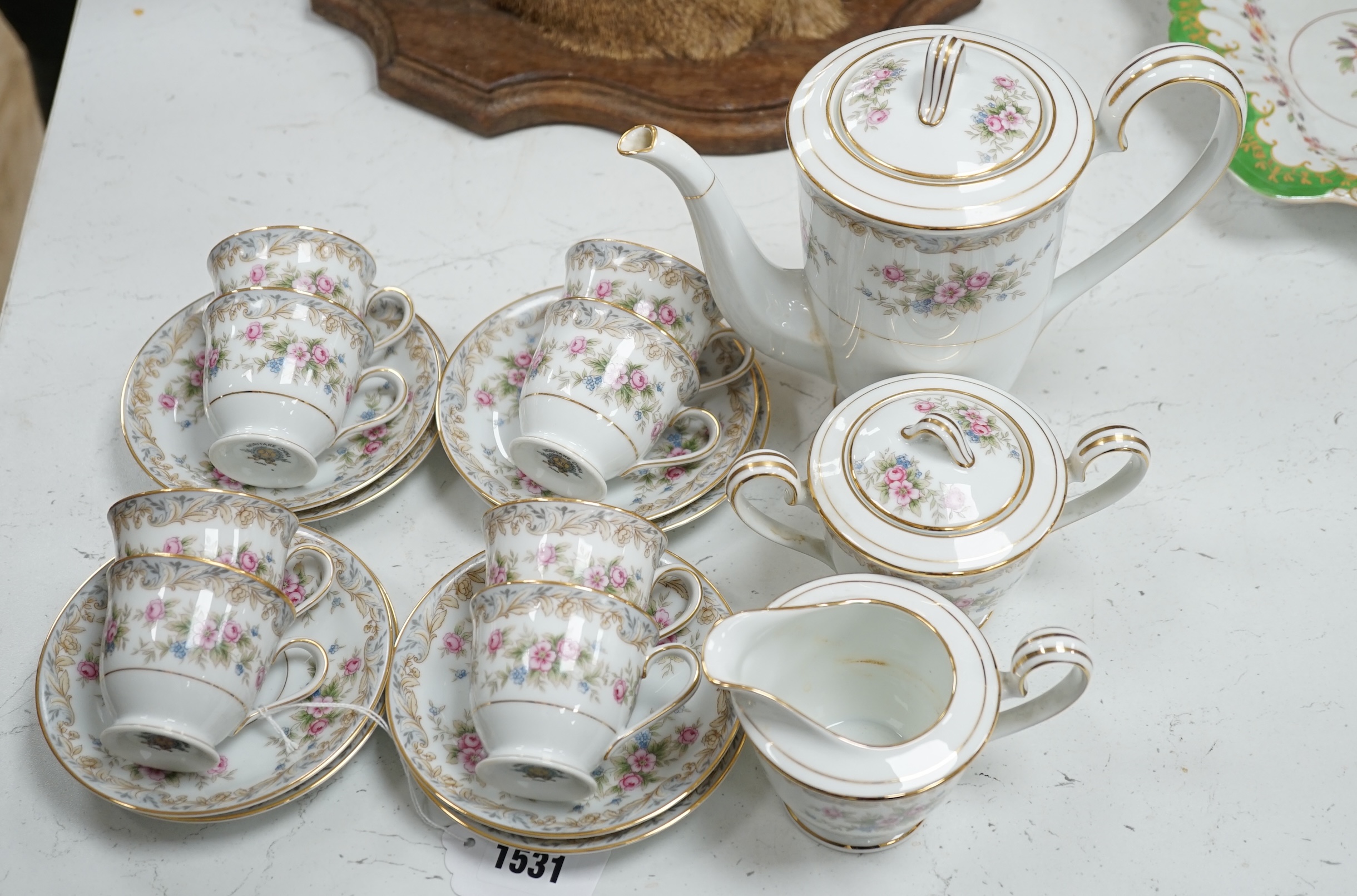 A Noritake eight cup and saucer floral coffee set